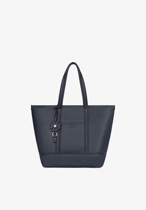 Sac cabas en cuir bleu marine avec double poignée et un pendentif décoratif en forme de fleur suspendu près du centre supérieur.