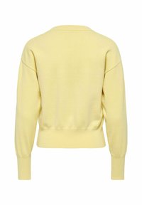 Gaiši dzeltens garroku džemperis ar ribām piedurknēs un jostasvietā, redzams no mugurpuses uz balta fona.