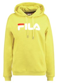 Žlutá mikina s kapucí, vpředu klokaní kapsa, šňůrky na kapuci a výrazné bílé logo FILA s červeným akcentem. Materiál: bavlněná směs.