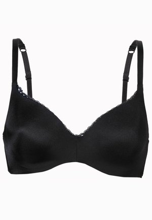 Reggiseno nero con spalline regolabili, tessuto morbido e bordi in pizzo lungo l'scollatura. Presenta un design senza cuciture e un profondo scollo a V nella parte anteriore.