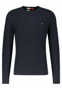 Námořnická modrá pletená mikina s vroubkovaným kulatým výstřihem, dlouhými rukávy a texturovaným vzorem. Obsahuje malé logo na hrudi.
