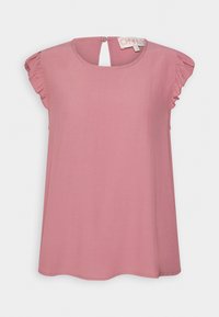 Blouse sans manches rose poudré avec encolure ronde, détails volantés aux épaules et fermeture boutonnée au dos.
