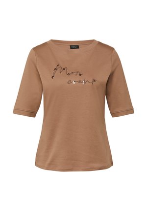 Brown short-sleeve shirt with "Mon coeur" embroidered in cursive and floral accents across the chest, round neckline, and relaxed fit.