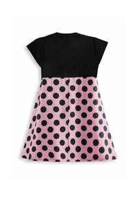 Robe à manches courtes avec un haut noir et une jupe rose ornée de grands pois noirs. Fabriquée en tissu lisse, avec une forme évasée en A.