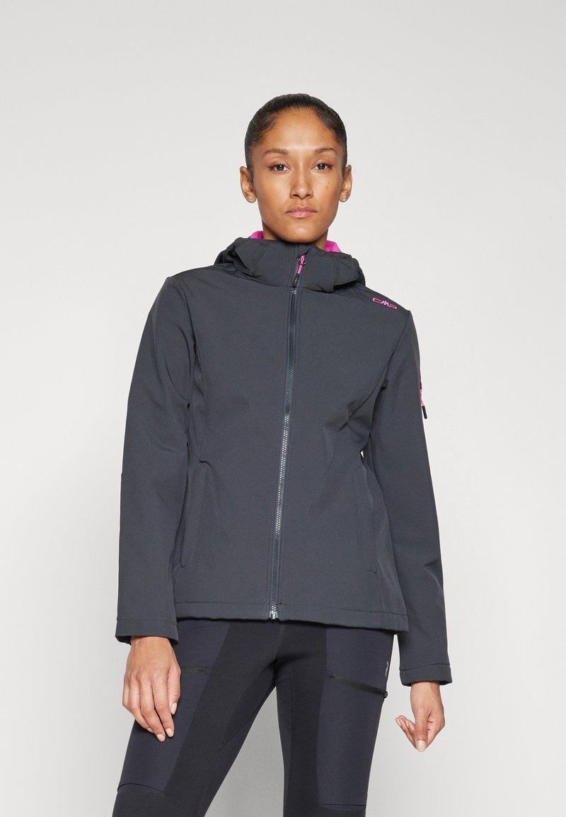 Black softshell jacket with a fitted design, featuring a hood, zippered pockets, and purple accents on the collar and zippers.