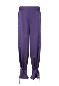 Purple satin trousers with embroidered snake motifs, wide-leg design, gathered cuffs with ties, smooth texture, and an adjustable waistband.