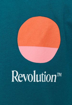 Teal fabric with a smooth texture; features a circular orange and pink graphic above the white text “Revolution™.”