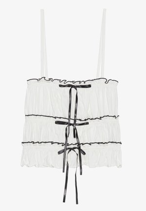 White sleeveless top with ruffled texture and black ribbon accents. Features gathered fabric and adjustable spaghetti straps.