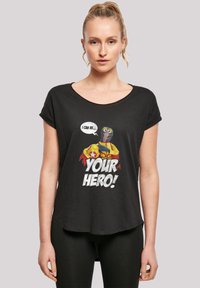 Black short-sleeve T-shirt with a relaxed fit, featuring a graphic print of two cartoon characters and the text "I CAN BE... YOUR HERO!"