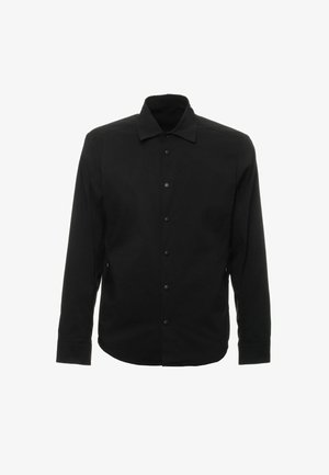Camicia nera con bottoni, colletto, maniche lunghe e orlo dritto. Realizzata in un tessuto liscio, presenta dettagli di bottoni discreti.