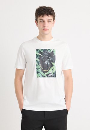 White cotton t-shirt featuring a central graphic of a black panther with green eyes surrounded by green foliage. Short sleeves, crew neckline.
