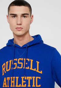 Russell Athletic Eagle R ICONIC TACKLE - Jersey con capucha - navy/orange