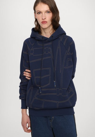Navy blue hoodie with a drawstring, featuring a geometric outline design in ochre. Material appears soft, with a relaxed fit and ribbed cuffs.