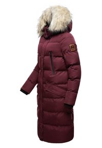 Burgundy puffer coat with faux fur-lined hood, zippered pockets, ribbed cuffs, and a brand patch on the sleeve. Features a long design.