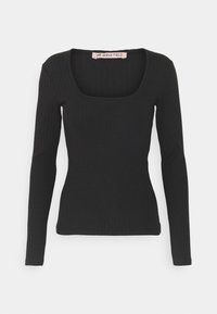 Black ribbed knit long-sleeve top with square neckline and fitted silhouette, labeled Anna Field.