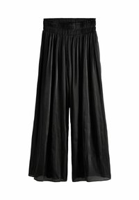 Culottes noires plissées avec une taille élastique, fabriquées en tissu léger, présentant un design fluide et une longueur raccourcie.