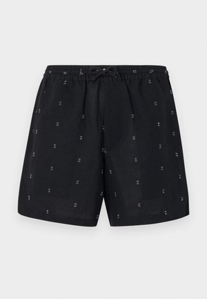 Shorts din in cu elastic la talie și șnur de ajustare. Prezintă modele geometrice mici, albe, pe întreaga țesătură.