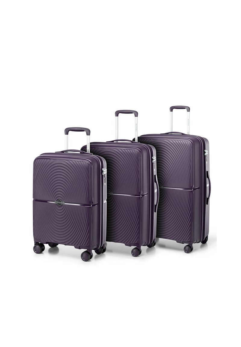 Tre valigie rigide viola con un motivo a onde, dotate di manici telescopici argentati e quattro ruote nere per una facile mobilità.