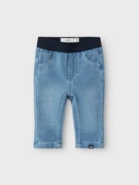 Světle modré džíny z denimu s námořnickým elastickým pasem, pěti kapsami a detaily šití. Spodní okraje jsou dokončeny úhledným lemem.
