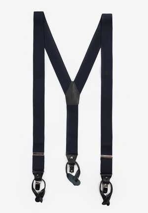 Tirantes elásticos en azul marino con un parche central de cuero negro y herrajes plateados. Diseñados en forma de 'M' con sujetadores de clip.