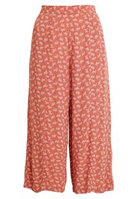 Pantalons larges en tissu léger, de couleur terracotta avec de petits motifs floraux blancs répartis sur toute la surface. Détail de taille élastique.