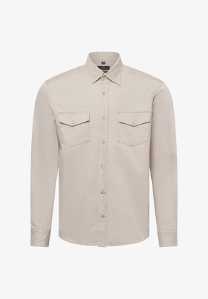 Beige Langarmhemd aus Baumwolle mit Button-Down-Kragen, zwei Brusttaschen und silbernen Druckknöpfen an der Vorderseite und den Taschen.