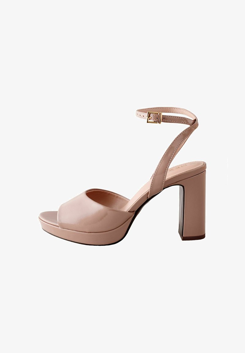 Beige patent leather high-heeled sandal with ankle strap and buckle, block heel, open toe, and platform sole.