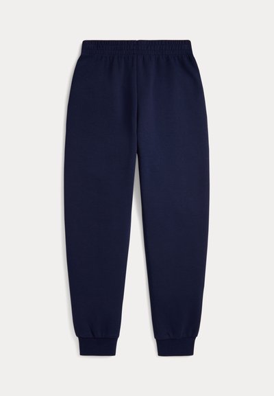 Pantalon de survêtement bleu marine avec taille et poignets élastiques, coupe droite, présenté à plat sur fond blanc.