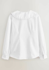 Weiße Bluse mit rüschenbesetztem Kragen, langen Ärmeln mit gerafften Manschetten und Knopfverschluss. Glattes Baumwollgewebe mit taillierter Passform.