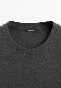 Dark gray sweater with a round neckline, made of soft fabric; features a ribbed collar and a label with "Massimo Dutti" text.