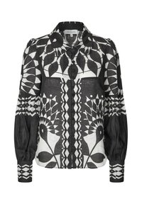 Black and white floral patterned blouse with a collar, buttons down the front, and puffed sleeves. Made of lightweight fabric.