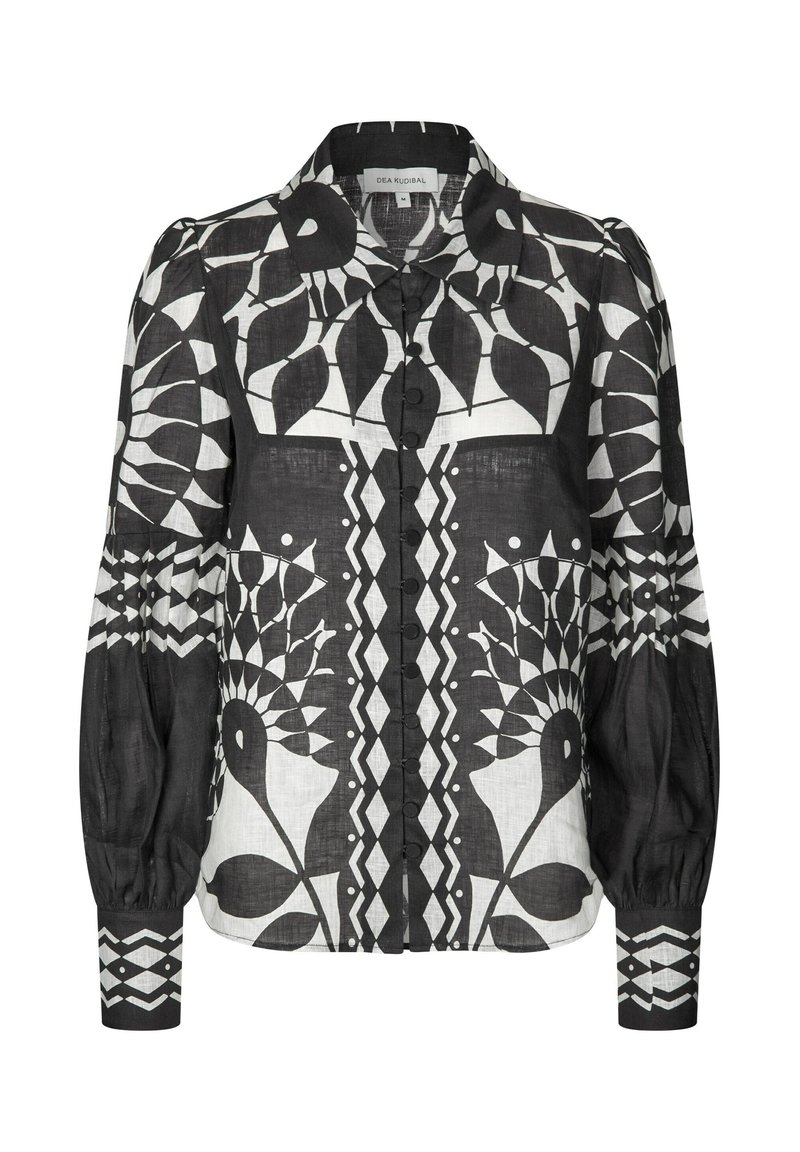 Black and white floral patterned blouse with a collar, buttons down the front, and puffed sleeves. Made of lightweight fabric.