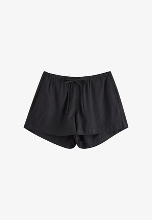 Czarne lniane szorty z elastycznym paskiem w talii i sznurkiem ściągającym, lekko zaokrąglonym dołem oraz luźnym krojem. Miękka, oddychająca tekstura.
