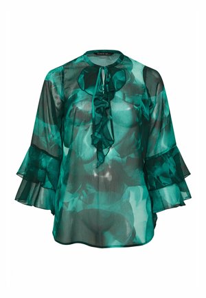 Gennemsigtig grøn blomstret bluse med flæset bindebånd ved halsen og lagdelte klokkeærmer, løs pasform, letvægtstof.