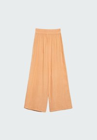 Persikanväriset leveälahkeiset housut, valmistettu kevyestä kankaasta, jossa on teksturoitu pinta ja joustava vyötärö mukavan istuvuuden takaamiseksi.