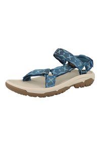 Blå mønstrede sandaler med justerbare stropper, beige blødt såle, teksturert gummisåle og lett design som er egnet for utendørsbruk.