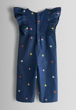 Tmavě modrý overal z denimu s krátkými volánkovými rukávy. Ozdobený barevnými vyšívanými květinami a zapínáním na knoflíky na zádech.
