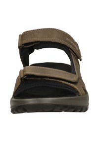 Brown sandal with two adjustable straps, textured sole, and a cushioned footbed. Material appears synthetic with stitched detailing.