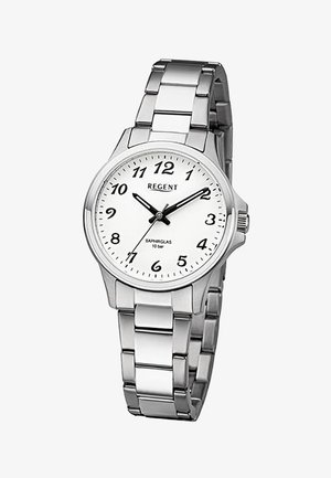 Montre-bracelet en métal argenté avec cadran blanc, chiffres arabes noirs et trois aiguilles noires indiquant 10:10:35.
