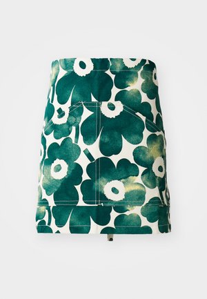 Jupe fleurie en vert et crème, avec un grand motif de fleurs, deux poches arrière et une coupe structurée en A. Matériau en toile.