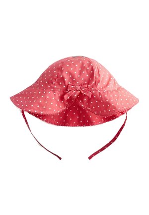 Pălărie de soare roz cu boruri largi cu buline albe, o fundiță mică în față și barete reglabile pentru bărbie.