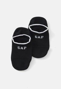 Crne čarape bez peta s bijelim kontrastnim rubom i bijelim ispisom "GAP" logo na gornjoj strani. Mekani materijal, rastezljivi materijal.