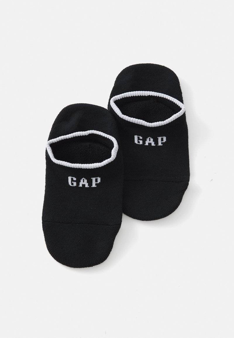 Crne čarape bez peta s bijelim kontrastnim rubom i bijelim ispisom "GAP" logo na gornjoj strani. Mekani materijal, rastezljivi materijal.