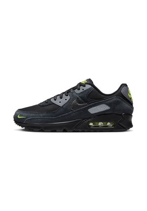 Czarne sneakersy Nike Air Max z ciemnoszarymi i neonowymi zielonymi akcentami, widoczną poduszką powietrzną w podeszwie, czarnymi sznurowadłami oraz logo Nike na boku i pięcie.