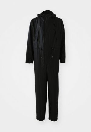 Black waterproof jumpsuit with a hood, front zip pocket, adjustable drawstring waist, elastic cuffs, and straight-leg design. Smooth texture.