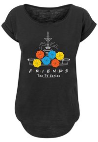 Black T-shirt featuring a graphic of a fountain and colorful umbrellas in yellow, orange, and blue, with "FRIENDS The TV Series" text.