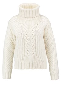 Sweter dziewczęcy w kolorze kremowym, robiony na drutach, z wysokim, prążkowanym kołnierzem. Posiada teksturowane warkocze i wzory w masywnym, przytulnym stylu. Krótka długość.