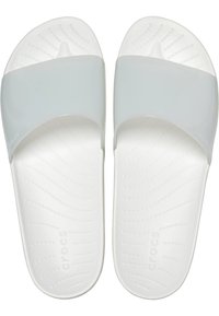 White Crocs slide sandals featuring a glossy light gray strap, a molded footbed with textured grip, and a contoured shape for comfort.