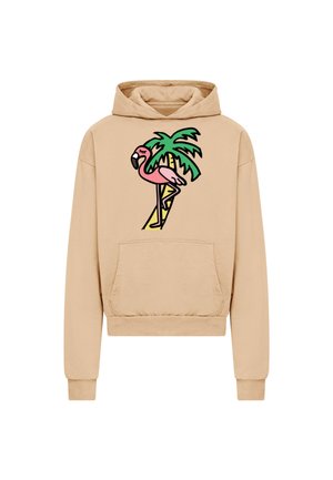 Sweat à capuche beige avec poche avant présentant un graphisme coloré d'un flamant rose debout à côté d'un palmier vert.