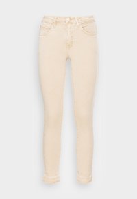 Jeans ajustados de color beige claro fabricados con una mezcla de algodón, que cuentan con cuatro bolsillos, un cierre de cremallera y un dobladillo de doble costura en los tobillos.